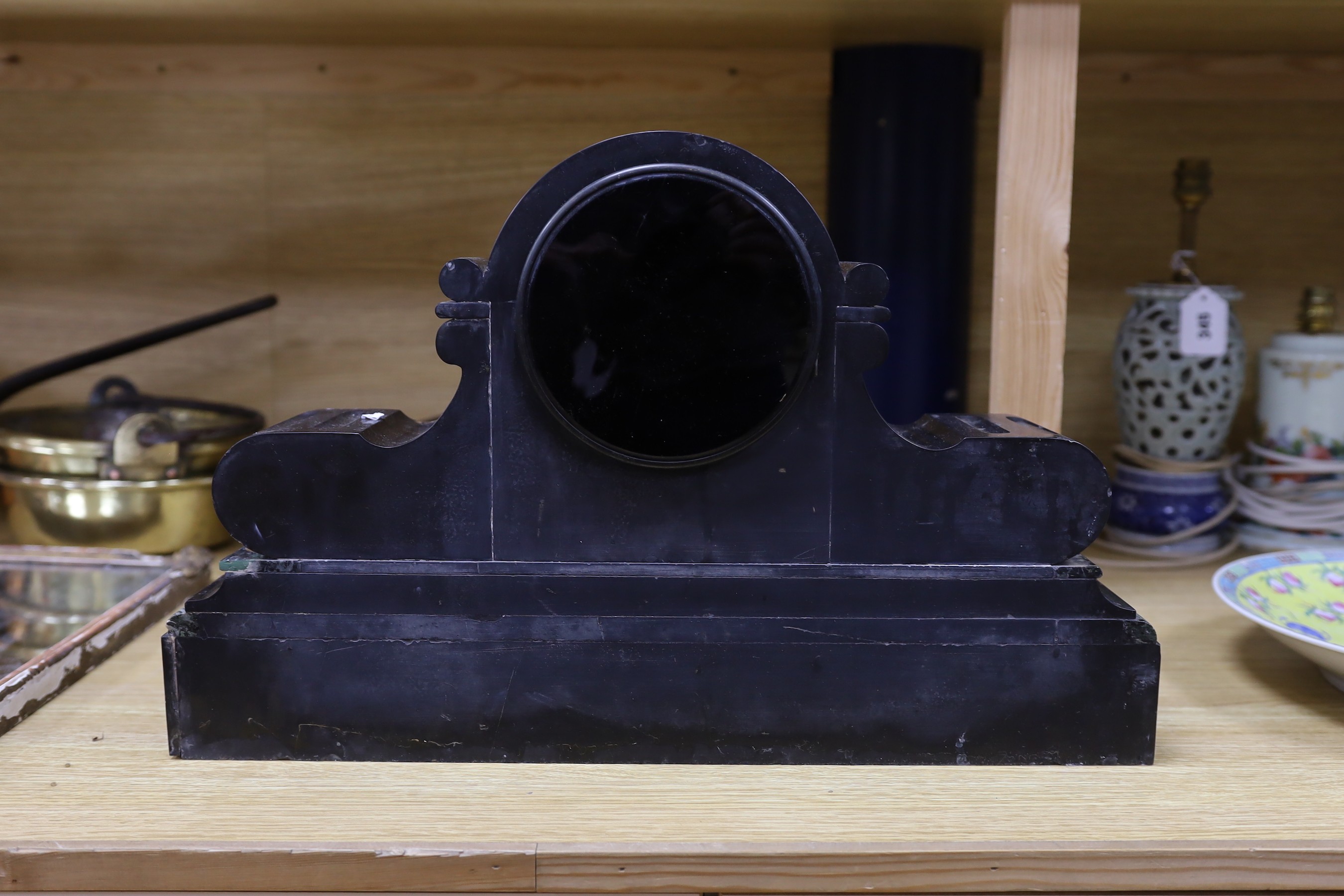 A French eight day slate clock, 50cms wide, 32cms high